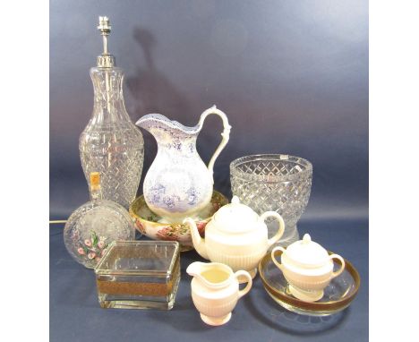 A three piece Wedgwood cream glazed tea set comprising teapot, covered sugar bowl and milk jug all with fluted detail, a Roya