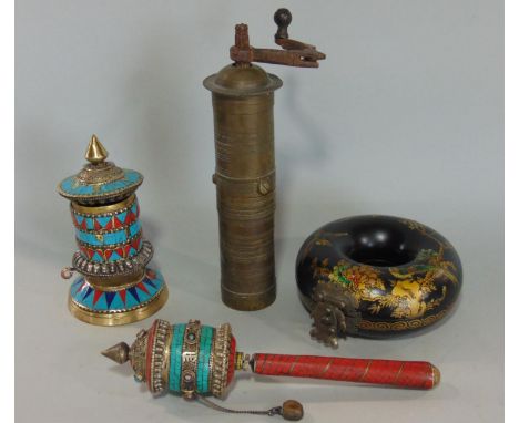 Two Buddhist prayer wheels with enamel and stone setting, a Turkish brass coffee grinder of cylindrical form and a further la