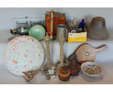 Box of interesting items to include pigeon clock, school bell, mottled glass Deco shade, fire dogs, bellows, vintage bottles,