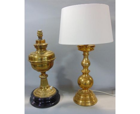 A brass oil lamp converted to electricity, 44 cm high, together with a further large brass table lamp, 37 cm high (2) 