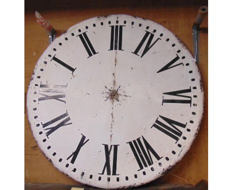 A large industrial style wall clock, the circular painted galvanised dial with Roman numerals and small battery movement (lac
