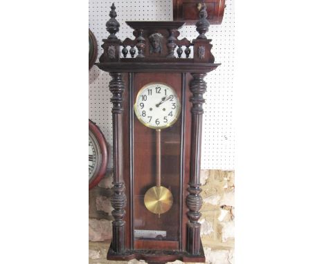 Vienna style regulator wall clock, with mahogany and ebonised case, twin train enamel dial, with Arabic numerals, 110cm long,