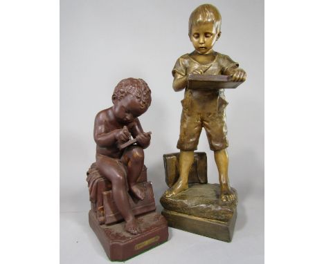 A Goldscheider plaster work figure of a standing schoolboy with satchel and slate and with moulded and impressed marks verso 