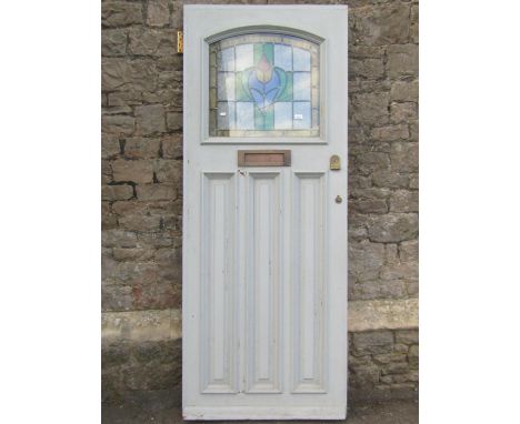 A reclaimed painted hardwood front door, enclosing an arched leaded light panel, over three slender fielded panels, 80cm wide