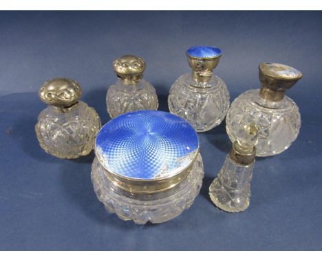 A collection of silver topped dressing bottles to include three guilloche enamel examples (af) and two embossed with art nouv