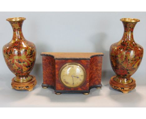 Early 20th century serpentine yewwood mantle clock with ebonised borders and gilt ball feet, with textured gilt dial and Roma