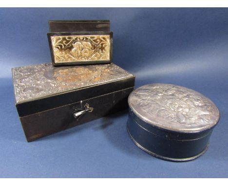 Blue leather and silver applied jewellery box, the hinged lid with embossed silver panel of cherubs enclosing a fitted interi