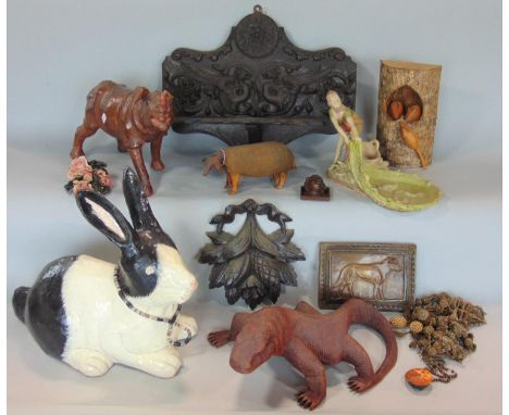 A miscellaneous group including a 19th century French spelter figure of a fisherman pulling in a net, a papier mache figure o