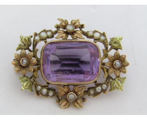 Victorian yellow metal amethyst brooch with floral bi-colour frame set with seed pearls, 3.1cm approx, 6.2g 