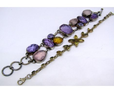 Two silver gem set bracelets; a citrine example and an amethyst and rose quartz example (2) 
