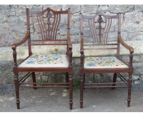 A pair of good quality graduated size inlaid mahogany open armchairs with trailing carved harebell splats, boxwood stringing,