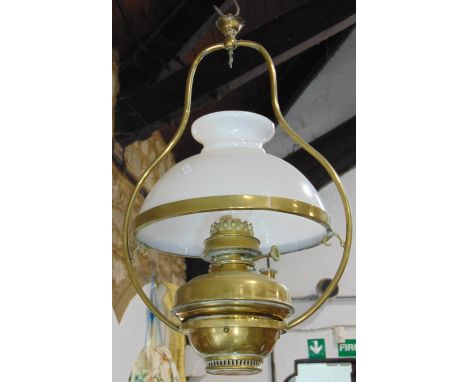 A Victorian brass celling oil lamp, with opaque white glass shade, later adapted for electricity and one other with wall brac