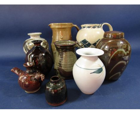 A collection of studio pottery wares including a Winchcombe pottery jug with applied teardrop type decoration, 20cm tall appr