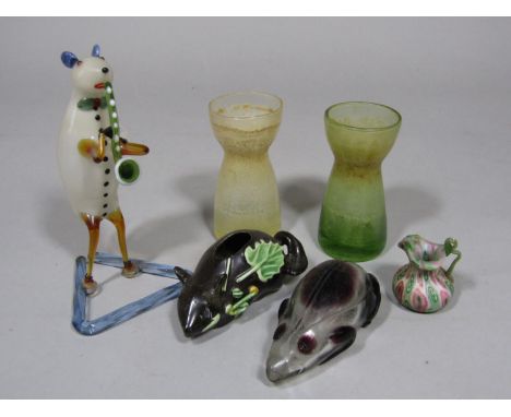 A small ceramic vase in the form of a mouse with applied leaf detail, a glass flask in the form of a frog, an unusual glass n