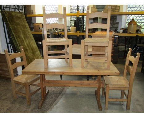 A stripped pine kitchen table of rectangular form raised on rectangular supports with pegged stretchers, 153 cm long x 69 cm 