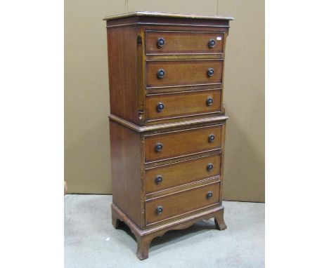 A small reproduction Georgian style tallboy fitted with six long drawers raised on splayed bracket supports, 57 cm wide x 38 
