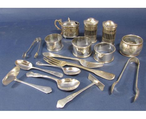A mixed collection of silver comprising various flatware including two sets of sugar nips, four napkin rings and a three piec