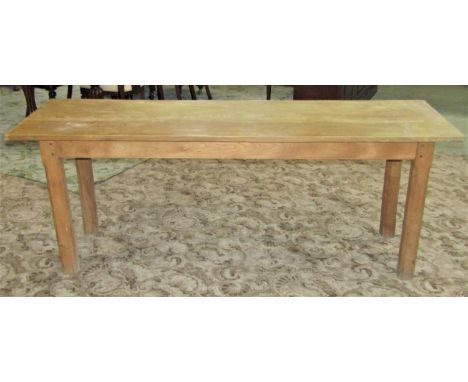 A light elm provincial narrow dining table, with rectangular top, raised on four square cut and chamfered legs, 199cm x 61cm 