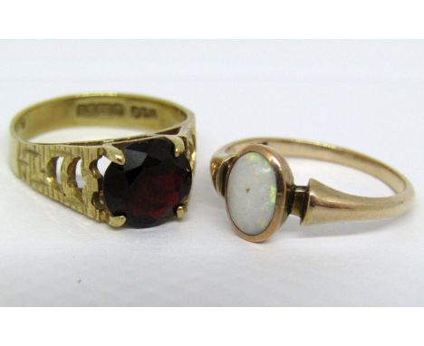 Two 9ct gem set rings; an opal and a garnet example, sizes M &amp; K/L, 4.2g total (2) 
