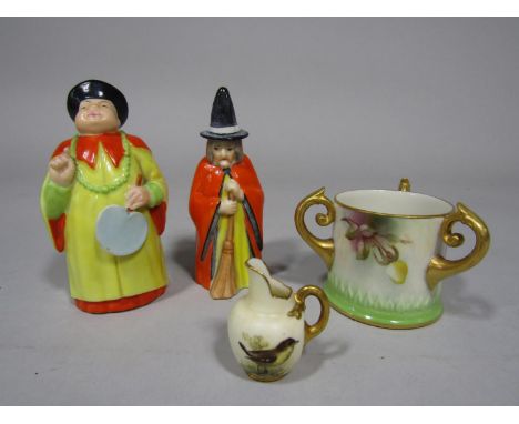 Two Royal Worcester candle snuffers in the form of a Chinese male character and a witch, both with puce printed marks to inte