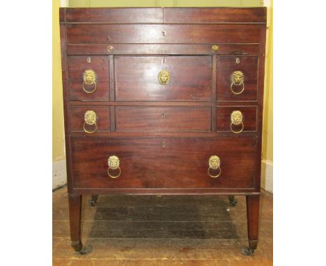 A Georgian gentleman's mahogany washstand with folding top revealing a fitted interior, the front elevation enclosing a writi