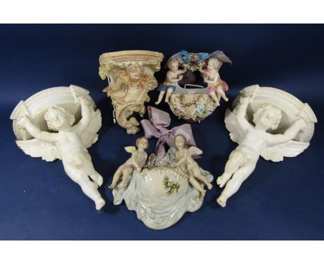 A pair of late 19th century Minton white glazed wall brackets modelled as winged cherubs and with impressed marks, 31 cm, tog