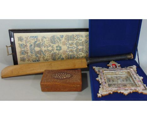 A serving tray - the base beneath glass with a pair of hand worked embroidered Chinese panels, a mother of pearl panel showin