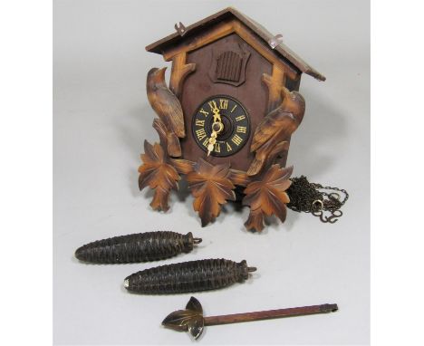 Black Forest type wall hanging cuckoo clock with two novelty weights 