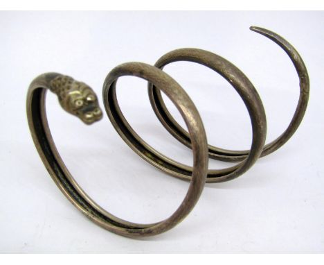 Victorian white metal coiled serpent bangle, stamped with lozenge mark and 'Standard' 