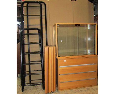 A contemporary Ladderax style light beechwood veneered modular shelving unit by Ikea of Sweden comprising glazed cabinet, fou