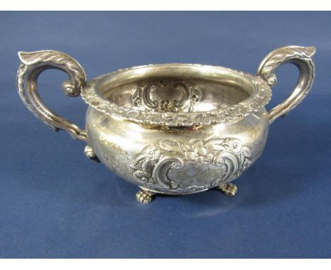 Irish silver sugar basin, of circular form, with embossed floral detail, two loop handles and acanthus detail, Dublin 1829, 1