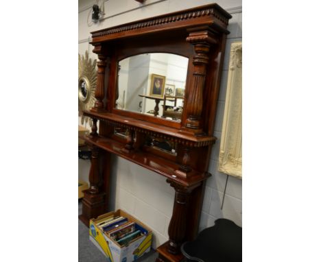 A mahogany fire surround with integral over mantle mirror 