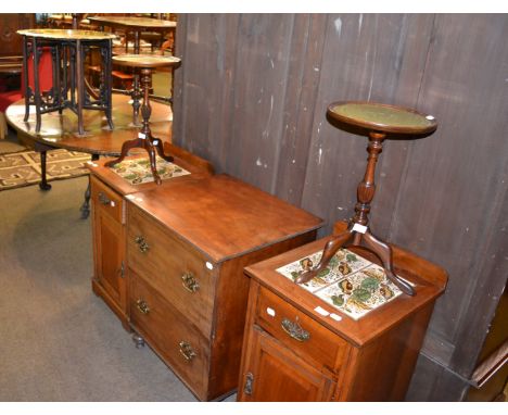 A group of furniture including a pair of tile inset bedside cupboards, a mahogany commode converted to a music cabinet, a pai