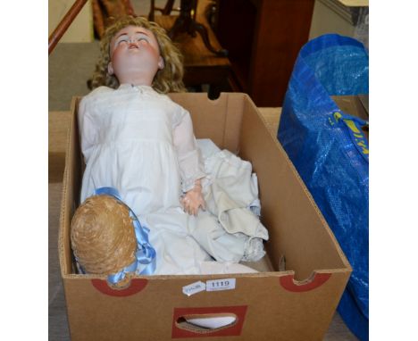 A Heinrich Handwerck Simon and Halbig 6.5 bisque socket head doll with weighted blue glass eyes, open mouth, brown wig, on a 