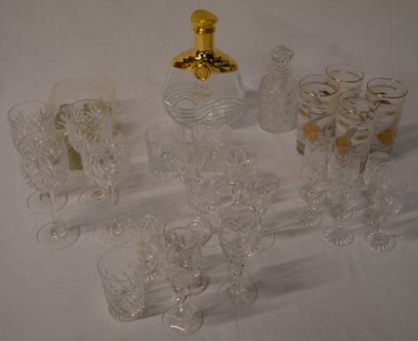 Glassware including a L'Or cognac bottle, decanter stoppers and drinking glasses