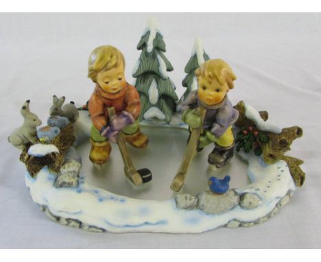 Goebel/Hummel 'Icy Adventure' display with 'Season's best' and 'Lets take to the Ice' figures (all boxed)