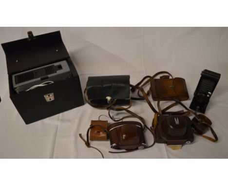 Assorted cameras including Kodak and a slide projector 