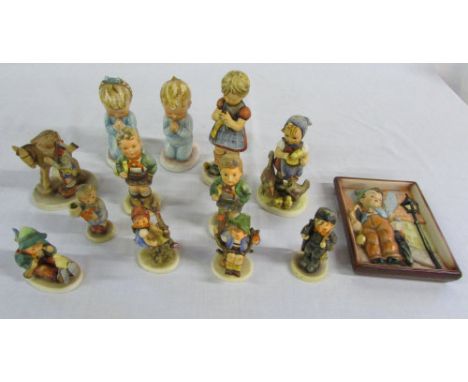 Various Hummel figurines and a plaque