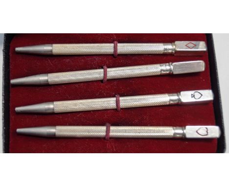 A cased set of four bridge pencils, stamped 'Sterling Silver', 8.5 cm long, with spare leads,  cased and in an Asprey card bo
