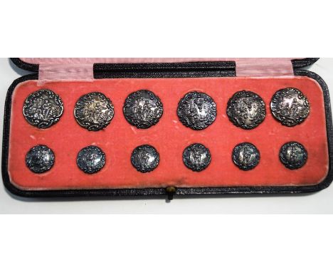 A matching set of six silver coat buttons and six blouse buttons, by Levi & Salaman, Birmingham 1900, the coat buttons, 2.7 c