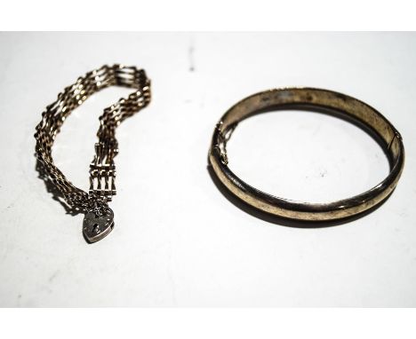 A Silver hinged bangle, together with a silver four bar gate bracelet