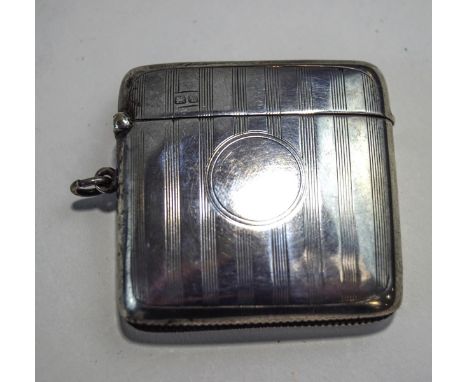 A silver vesta case, by Walker & Hall, Chester 1920, with linear engine turned decoration, 37 g gross