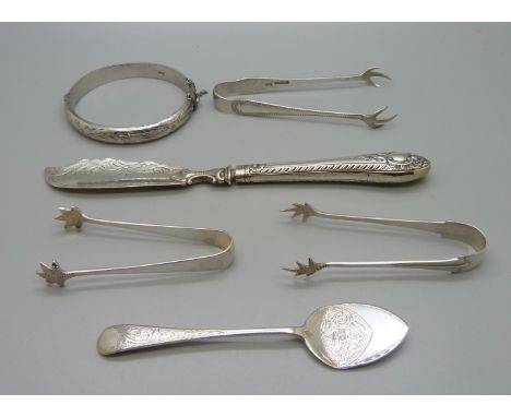 Silver items; three sugar bows, preserve spoon, preserve knife with silver blade and a silver bangle, total weight 120g 