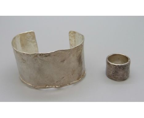 A hand made bangle and ring, both test as high content silver, 51g, the ring marked 1000 