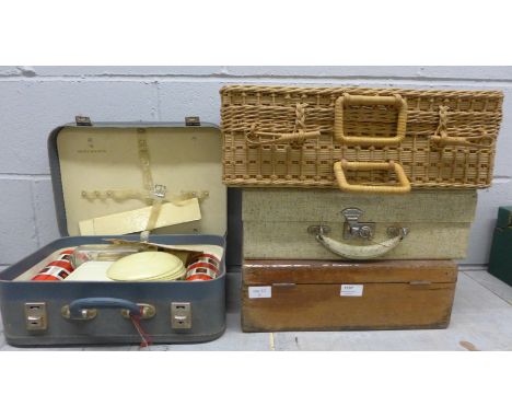 A vintage picnic set, a wicker basket and two cases 