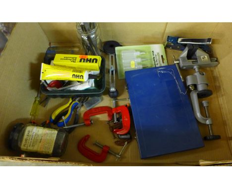 A box of mixed model making tools and equipment, tweezers, pliers, a table vice, small G-clamps, a box of various glue, etc. 