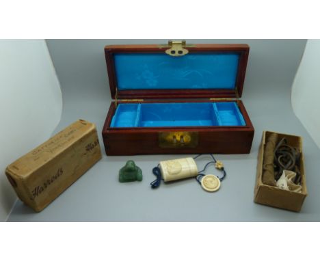 An Asian jewellery box, a jade Buddha, an inro and a Harrods sewing kit gift box