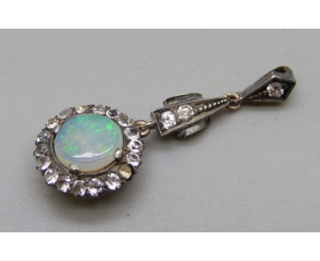 A vintage opal and white stone cluster pendant, gold back and silver setting 