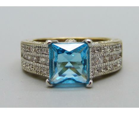 A silver gilt, topaz and white stone ring, O 