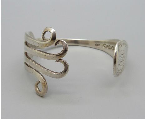 A bangle made from a Victorian silver fork, 47g 